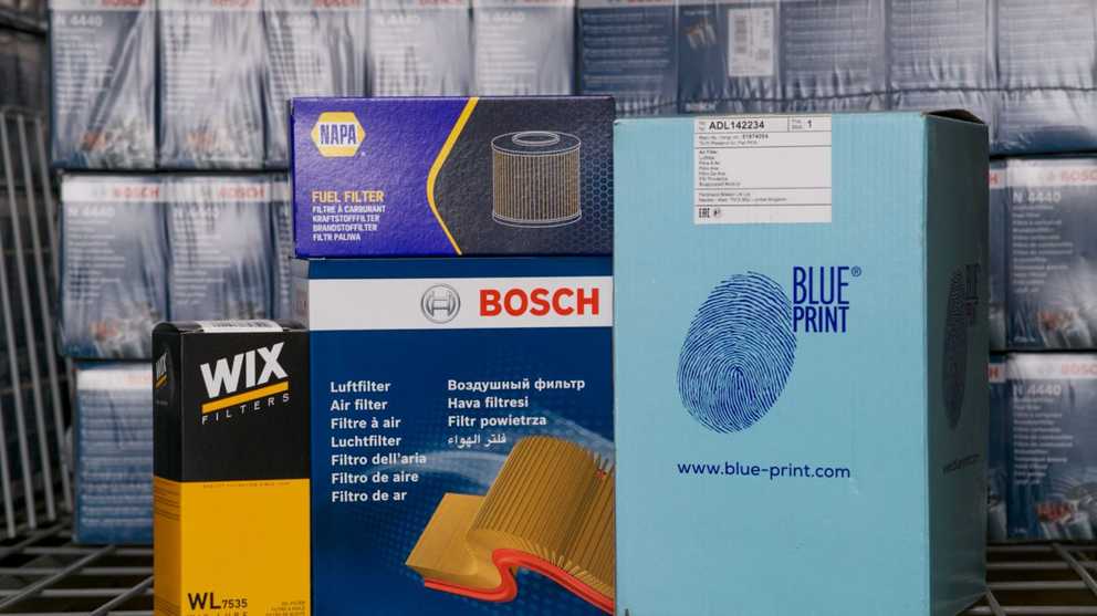 A number of part boxes with the brands, Wix, NAPA, Bosch &amp; Blueprint on it. 